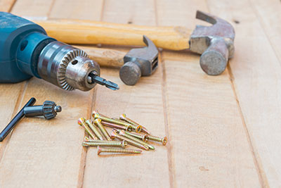 screw-driver Screw driver and hammers with pile of screws