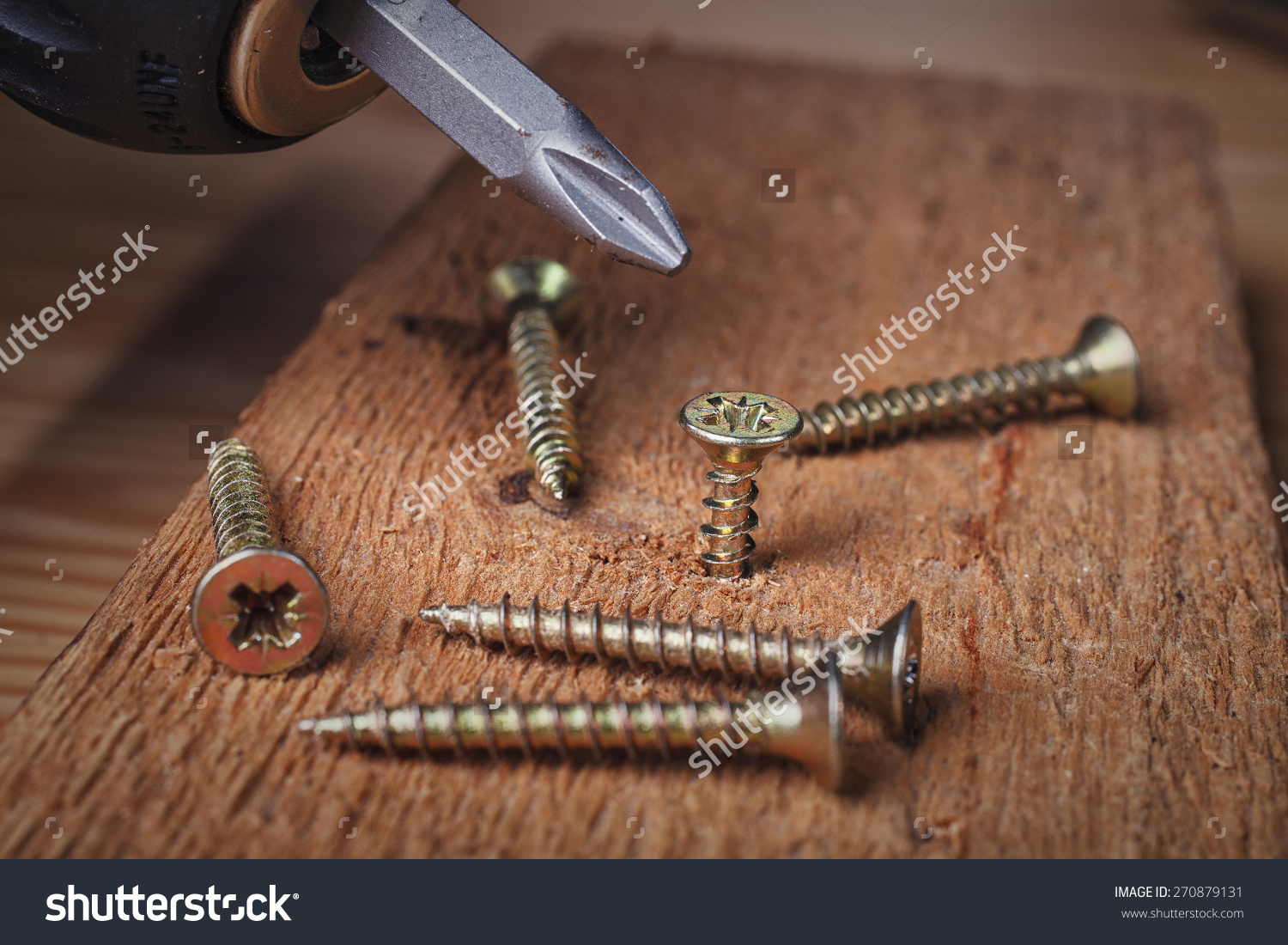 stockphotoscrewbeingscrewedintoapieceofwood270879131 South